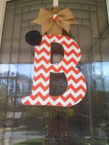 Orange Chevron Fabric Covered Letter. Letters are 13 1/2 inches tall with added decor piece and burlap hanger. Decor piece can be customized upon request!