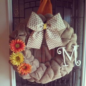 Perfect Spring/Summer wreath. It is made with brown burlap with added white chevron bow and letter. It also has added flowers to give it that little extra!