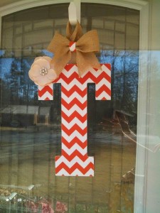 Orange Chevron Fabric Covered Letter. Letters are 13 1/2 inches tall with added decor piece and burlap hanger. Decor piece can be customized upon request!