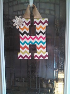 Multi-Collored Chevron Fabric Covered Letter. Letters are 13 1/2 inches tall with added decor piece and burlap hanger. Decor piece can be customized upon request!