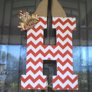 Orange Chevron Fabric Covered Letter. Letters are 13 1/2 inches tall with added decor piece and burlap hanger. Decor piece can be customized upon request!