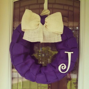 Purple burlap wreath with white accent bow and letter