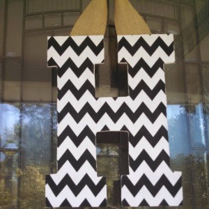 Black Chevron Fabric Covered Letter. Letters are 13 1/2 inches tall with added decor piece and burlap hanger. Decor piece can be customized upon request!