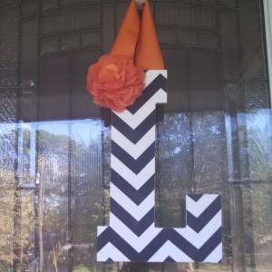 Navy Chevron Fabric Covered Letter. Letters are 13 1/2 inches tall with added decor piece and burlap hanger. Decor piece can be customized upon request!