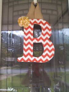 Orange Chevron Fabric Covered Letter. Letters are 13 1/2 inches tall with added decor piece and burlap hanger. Decor piece can be customized upon request!