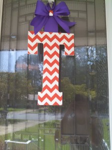 Orange Chevron Fabric Covered Letter. Letters are 13 1/2 inches tall with added decor piece and burlap hanger. Decor piece can be customized upon request!