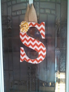 Orange Chevron Fabric Covered Letter. Letters are 13 1/2 inches tall with added decor piece and burlap hanger. Decor piece can be customized upon request!