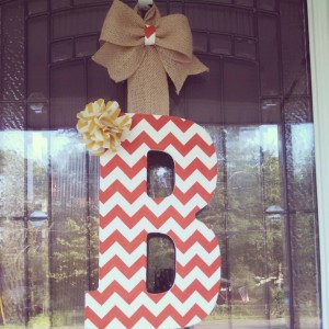 Orange Chevron Fabric Covered Letter. Letters are 13 1/2 inches tall with added decor piece and burlap hanger. Decor piece can be customized upon request!