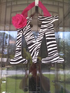 Zebra Print Fabric Covered Letter. Letters are 13 1/2 inches tall with added decor piece and burlap hanger. Decor piece can be customized upon request!