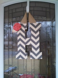 Grey Chevron Fabric Covered Letter. Letters are 13 1/2 inches tall with added decor piece and burlap hanger. Decor piece can be customized upon request!