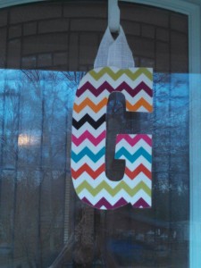 Multi-Colored Chevron Fabric Covered Letter. Letters are 13 1/2 inches tall with added decor piece and burlap hanger. Decor piece can be customized upon request!