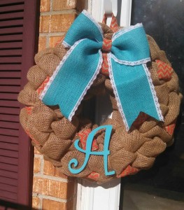 Beautiful Spring/Summer Wreath. It is Brown Burlap with pops of orange chevron it in. It is accented with a Tiffany Blue bow and letter!